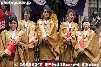 Procession maidens pose with wooden penises.
Keywords: aichi komaki kumano jinja shrine penis festival fertility honen matsuri