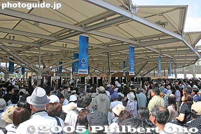 9:37 am: North Gate bottleneck for security check. Passed through by 9:45 am. Hardly a thorough check of your bags which also go through a metal detector machine. No bottled liquids allowed.
Keywords: Aichi Nagakute Expo 2005 crowds