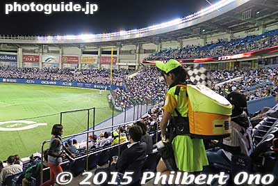 The beer girls wear a backpack of beer and dart up and down the spectator seats to sell beer that they dispense into a cup.
Keywords: chiba lotte marines baseball Marine Stadium QVC Field beer girl