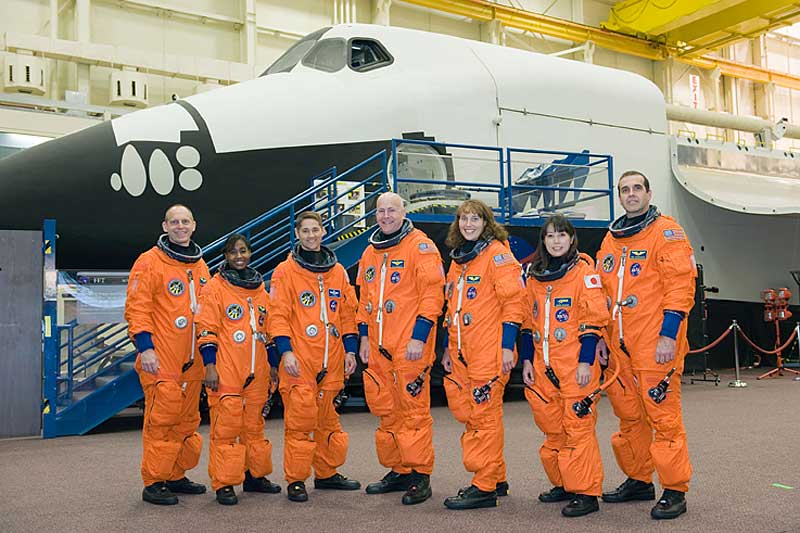 9 Dec. 2009 --- The STS-131 crew members, attired in training versions of their shuttle launch and entry suits, take a moment to pose for a crew photo prior to a training session...
9 Dec. 2009 --- The STS-131 crew members, attired in training versions of their shuttle launch and entry suits, take a moment to pose for a crew photo prior to a training session in the Space Vehicle Mock-up Facility at NASA's Johnson Space Center. Pictured from the left are NASA astronauts Clayton Anderson and Stephanie Wilson, both mission specialists; James P. Dutton Jr., pilot; Alan Poindexter, commander; Dorothy Metcalf-Lindenburger, Japan Aerospace Exploration Agency (JAXA) astronaut Naoko Yamazaki and NASA astronaut Rick Mastracchio, all mission specialists.
