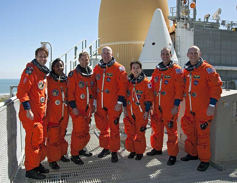 2010 March 5 -- After emergency escape training during Terminal Countdown Demonstration Test, the crew poses for a picture at Kennedy Space Center.
