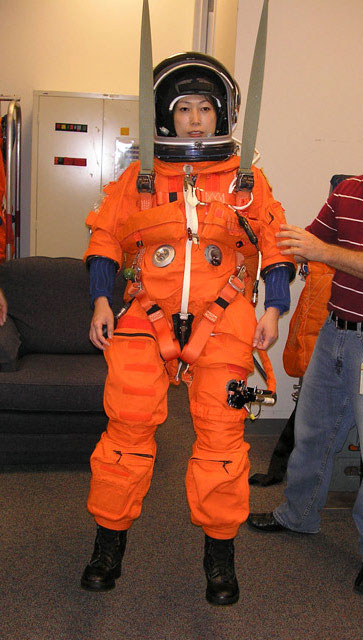 2009 May 15 -- Checking the fit of her pressurized suit at Johnson Space Center.

