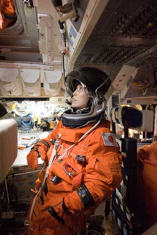 Naoko Yamazaki, attired in a training version of her shuttle launch and entry suit, participates in a training session in one of the full-scale trainers in the Space Vehicle Mock-up Facility at Johnson Space Center.
14 Sept. 2009 --- Japan Aerospace Exploration Agency (JAXA) astronaut Naoko Yamazaki, STS-131 mission specialist, attired in a training version of her shuttle launch and entry suit, participates in a training session in one of the full-scale trainers in the Space Vehicle Mock-up Facility at NASA's Johnson Space Center.
