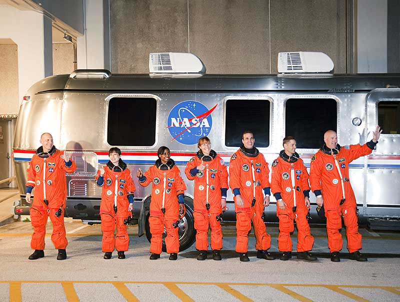 5 April 2010 --- After suiting up, the STS-131 crew members pause alongside the Astrovan to wave farewell to onlookers before heading for launch pad 39A...
5 April 2010 --- After suiting up, the STS-131 crew members pause alongside the Astrovan to wave farewell to onlookers before heading for launch pad 39A for the launch of space shuttle Discovery on the STS-131 mission. From the right are NASA astronauts Alan Poindexter, commander; James P. Dutton Jr., pilot; Rick Mastracchio, Dorothy Metcalf-Lindenburger, Stephanie Wilson, Japan Aerospace Exploration Agency (JAXA) astronaut Naoko Yamazaki and NASA astronaut Clayton Anderson, all mission specialists. Liftoff of the STS-131 mission is set for 6:21 a.m. (EDT) on April 5. On STS-131, the seven-member crew will deliver the multi-purpose logistics module Leonardo, filled with supplies, a new crew sleeping quarters and science racks that will be transferred to the International Space Station's laboratories. The crew also will switch out a gyroscope on the station's truss structure, install a spare ammonia storage tank and retrieve a Japanese experiment from the station's exterior. STS-131 is the 33rd shuttle mission to the station and the 131st shuttle mission overall.
