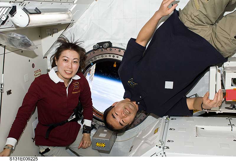 12 April 2010 --- Naoko Yamazaki (left), STS-131 mission specialist; and Soichi Noguchi, Expedition 23 flight engineer, pose for a photo near a window in the Kibo laboratory...
12 April 2010 --- Japan Aerospace Exploration Agency (JAXA) astronauts Naoko Yamazaki (left), STS-131 mission specialist; and Soichi Noguchi, Expedition 23 flight engineer, pose for a photo near a window in the Kibo laboratory of the International Space Station while space shuttle Discovery remains docked with the station.
