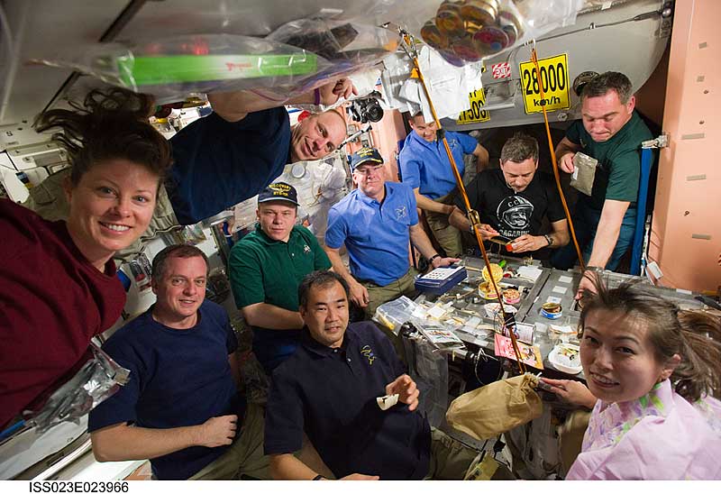 14 April 2010 --- STS-131 and Expedition 23 crew members share a meal in the Unity node of the International Space Station. Naoko wears a pink kimono.
14 April 2010 --- STS-131 and Expedition 23 crew members share a meal in the Unity node of the International Space Station while space shuttle Discovery remains docked with the station. Pictured are Russian cosmonauts Oleg Kotov, Expedition 23 commander; Mikhail Kornienko and Alexander Skvortsov, both Expedition 23 flight engineers; NASA astronauts Alan Poindexter, STS-131 commander; James P. Dutton Jr., STS-131 pilot; Clayton Anderson, STS-131 mission specialist; Tracy Caldwell Dyson and T.J. Creamer, both Expedition 23 flight engineers; Japan Aerospace Exploration Agency astronauts Soichi Noguchi, Expedition 23 flight engineer; and Naoko Yamazaki, STS-131 mission specialist.
