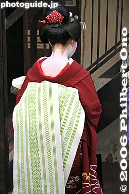 Back of a Maiko, Kyoto
The maiko is an apprentice geisha (or geiko). She can be easily identified by the long length of her kimono sleeves and the long length of her obi sash on her back.
[url=http://photoguide.jp/pix/thumbnails.php?album=318]See more photos of Kyoto geisha here.[/url]
Keywords: japangeisha