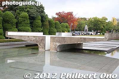 Peace Flame aligned with the Cenotaph and Atomic Bomb Dome. 
Keywords: hiroshima peace memorial park atomic bomb cenotaph