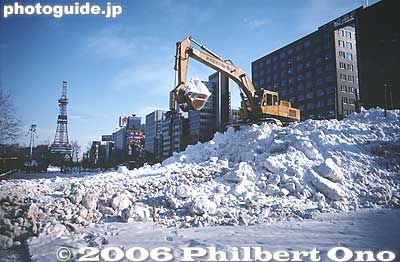 The local Self-Defense Forces build the giant snow sculptures. Power shovel piles up the snow inside a rectangular mold or box made of wood.
Keywords: hokkaido sapporo snow festival