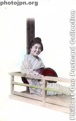 Laughing Geisha on terrace. It looks like she's on the veranda of a restaurant along a river. If she's a Kyoto geisha, it would be the Kamo River. But these cards were made in Yokohama. I wonder if she was from Yokohama.
Keywords: japanese vintage postcards nihon bijin women beauty geisha maiko woman smiling smile laughing kimono