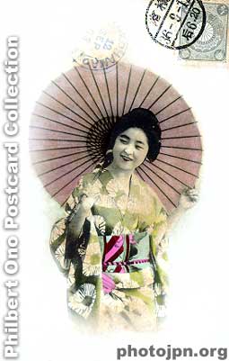 Laughing Geisha with umbrella. As you may have noticed, the umbrella (and fan) was a commonly used prop in tourist photos. Postmarked 1903 from Yokohama. The actual card is more yellowed and almost brown, but I bleached it with Photoshop.
Keywords: japanese vintage postcards nihon bijin women beauty geisha maiko woman smiling smile laughing kimono