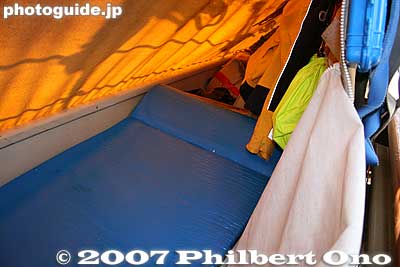 Sleeping compartment provides bed padding with a built-in pillow. Above it is the canvas covering (kapalina).
Keywords: kanagawa yokohama port hokulea canoe boat sail hawaiian