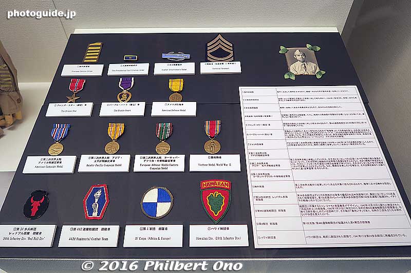 Military medals, badges, and patches from Saburo Ishitani of the 100th Infantry Battalion.
