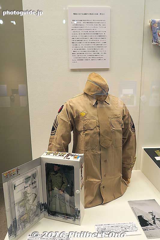 100th Infantry Battalion nisei's cotton khaki shirt and garrison cap. From Saburo Ishitani. Also, a 442nd RCT nisei soldier doll (nicknamed "Yoshi" or "Tak") made in 2000 and sold by a toy store in Portland, Oregon.
