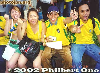 Without question, there were many more fans and supporters of Brazil than Germany. Yellow and green T-shirts far outnumbered Germany's colors.
Keywords: world cup soccer game yokohama 2002 fans brazil germany women