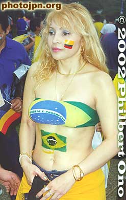 German flag on her cheek and the Brazilian flag on her belly.
Keywords: world cup soccer game yokohama 2002 fans brazil germany women