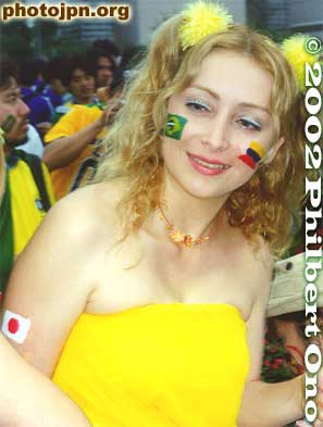 Besides the Brazilian and German flags, this woman went one step further with a Japanese flag on her arm.
Keywords: world cup soccer game yokohama 2002 fans brazil germany women