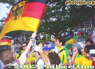 Supporters of both teams have a friendly shout down.
Keywords: world cup soccer game yokohama 2002 fans brazil germany