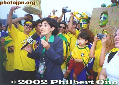 Everyone is cheering in front of the TV camera from Brazil.
Keywords: world cup soccer game yokohama 2002 fans brazil germany
