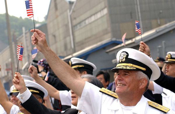 Yokosuka, Japan (May 6, 2003) -- Rear Adm. Robert C. Chaplin, Commander, U.S. Naval Forces Japan waives an American flag as the USS Kitty Hawk (CV 63) returns home from conducting operations in support of Operation Iraqi Freedom.
Yokosuka, Japan (May 6, 2003) -- Rear Adm. Robert C. Chaplin, Commander, U.S. Naval Forces Japan waives an American flag as the USS Kitty Hawk (CV 63) returns home from conducting operations in support of Operation Iraqi Freedom. Operation Iraqi Freedom is the multi-national coalition effort to liberate the Iraqi people, eliminate Iraq's weapons of mass destruction and end the regime of Saddam Hussein. U.S. Navy photo by Photographer’s Mate 2nd Class Michael Damron. (RELEASED)

