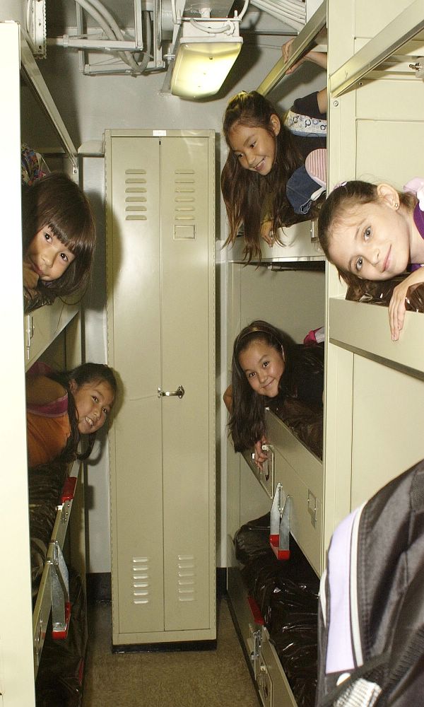 Yokosuka, Japan (Sept. 22, 2005) - Students from Ikego Elementary School, Japan, experience first-hand what it is like to live in ship's berthing during a tour aboard the conventionally powered aircraft carrier USS Kitty Hawk.
Yokosuka, Japan (Sept. 22, 2005) - Students from Ikego Elementary School, Japan, experience first-hand what it is like to live in ship's berthing during a tour aboard the conventionally powered aircraft carrier USS Kitty Hawk (CV 63). During the tour the students visited the flight deck, forecastle, hangar bay and an unoccupied berthing area while learning about the life of Sailors aboard a U.S. Navy ship. U.S. Navy photo by Photographer's Mate Airman Matthew Reinhardt (RELEASED)
