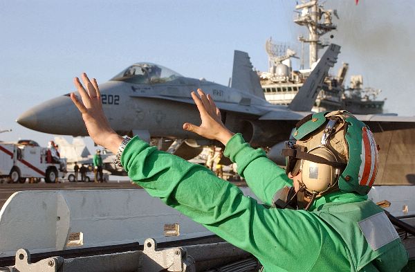 At sea aboard USS Kitty Hawk (CV 63) Nov. 14, 2002 -- Aviation Boatswain’s Mate 2nd Class Daniel Gadea from San Francisco, Calif., signals “ready shoot” before pushing the launch catapult button.
At sea aboard USS Kitty Hawk (CV 63) Nov. 14, 2002 -- Aviation Boatswain’s Mate 2nd Class Daniel Gadea from San Francisco, Calif., signals “ready shoot” before pushing the launch catapult button. Petty Officer Gadea’s job is to launch aircraft once the signal is given from the “shooter.” Kitty Hawk is the Navy’s only permanently forward-deployed aircraft carrier and operates out of Yokosuka, Japan. U.S. Navy photo by Photographer’s Mate 3rd Class Todd Frantom. (RELEASED)
