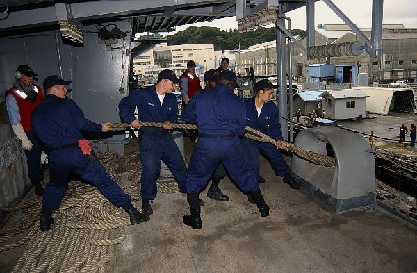 Aboard USS Kitty Hawk (CV 63) Oct. 13, 2003 -- Boatswain’s Mates from Deck Department’s 3rd division heave in mooring lines during USS Kitty Hawk’s (CV 63) departure for sea trials.
Aboard USS Kitty Hawk (CV 63) Oct. 13, 2003 -- Boatswain’s Mates from Deck Department’s 3rd division heave in mooring lines during USS Kitty Hawk’s (CV 63) departure for sea trials. The aircraft carrier recently completed an extensive five-month maintenance period in Yokosuka, Japan, following her deployment in support of Operation Iraqi Freedom. U.S. Navy photo by Photographer’s Mate 3rd Class Jason R. Williams. (RELEASED)
