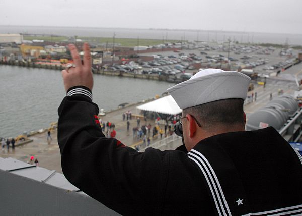 NORFOLK, Va. (Feb. 7, 2008) A USS George Washington (CVN 73) Sailor waves goodbye to his family on the pier as the aircraft carrier departs Naval Station Norfolk.
NORFOLK, Va. (Feb. 7, 2008) A USS George Washington (CVN 73) Sailor waves goodbye to his family on the pier as the aircraft carrier departs Naval Station Norfolk. George Washington departed Norfolk en route to Yokosuka, Japan, where it will replace USS Kitty Hawk (CV 63) as the U.S. Navy's only forward-deployed aircraft carrier. U.S. Navy photo by Mass Communication Specialist 3rd Class Ian Schoeneberg (Released)

