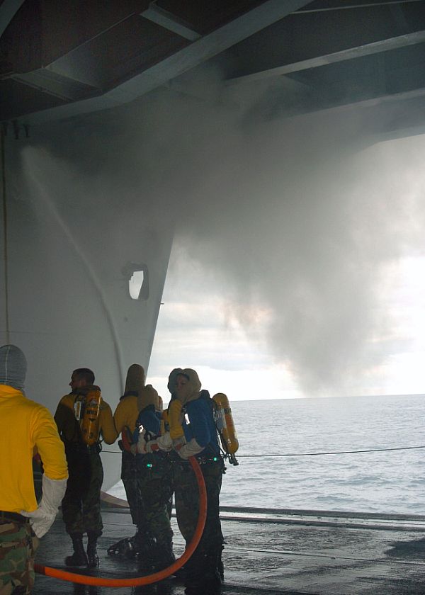 PACIFIC (May 22, 2008) Crew members aboard USS George Washington (CVN 73) conduct comprehensive firefighting efforts to extinguish a fire that spread to several spaces via cableways, creating extreme heat and smoke.
PACIFIC (May 22, 2008) Crew members aboard USS George Washington (CVN 73) conduct comprehensive firefighting efforts to extinguish a fire that spread to several spaces via cableways, creating extreme heat and smoke. The crew was able to contain the fire while limiting shipboard damage and preventing any serious injuries to the crew. The cause of the fire and the extent of the damage are currently under investigation as the ship continues on course for San Diego. U.S. Navy photo (Released)
