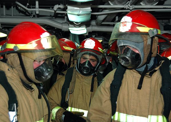  The crew was able to contain the fire while limiting shipboard damage and preventing any serious injuries to the crew.
PACIFIC (May 22, 2008) Crew members aboard USS George Washington (CVN 73) conduct comprehensive firefighting efforts to extinguish a fire that spread to several spaces via cableways, creating extreme heat and smoke. The crew was able to contain the fire while limiting shipboard damage and preventing any serious injuries to the crew. The cause of the fire and the extent of the damage are currently under investigation as the ship continues on course for San Diego. U.S. Navy photo (Released)

