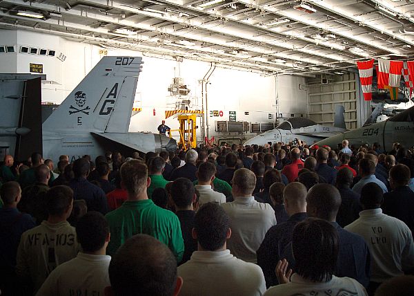 PACIFIC (May 22, 2008) Command Master Chief Jeffrey R. Clark Sr. addresses the assembled crew in the hangar bay of USS George Washington (CVN 73). Enlisted Sailors, regardless of rank, worked together to remove debris from the main decks.
PACIFIC (May 22, 2008) Command Master Chief Jeffrey R. Clark Sr. addresses the assembled crew in the hangar bay of USS George Washington (CVN 73). Enlisted Sailors, regardless of rank, worked together to remove debris from the main decks. The clean-up evaluation commenced this morning following yesterday's fire. The comprehensive firefighting effort extinguished all fires while limiting shipboard damage and preventing any serious injuries for the crew. The cause of the fire and the extent of the damage are currently under investigation as the ship continues on course for San Diego. U.S. Navy Photo by Chief Mass Communication Specialist Katrin Albritton (Released)
