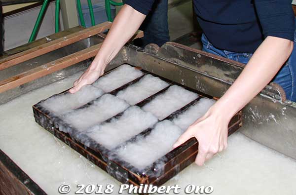 Takes three years to learn how to make washi paper with a mold. Ten years to become an expert. 
But we did it in a minute or two... Just dip the mold into the fibrous water, and swish it to the left/right and forward/back.
Keywords: kyoto ayabe Kurotani washi paper making