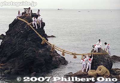 One by one, the men carefully positioned the new sacred ropes on the two Rocks.  All the while, young children and young men are chanting on the shore.
Keywords: mie ise futami-cho meoto iwa wedded rocks shimenawa rope ocean okitama shrine matsuri festival