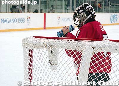 Japan's goalie takes a break at Nagano Winter Olympics women's ice hockey match.
Her helmet is dotted with Print Club photo stickers.
Keywords: nagano prefecture 1998 winter olympics japansports