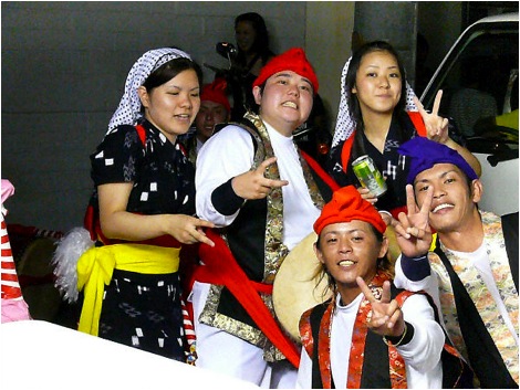 For their parting shot, these Eisa dancers couldn’t resist flashing the Peace sign along with their smiles for the camera. 
Photo copyright 2009 Michael Lynch.
Keywords: okinawa kin eisa obon dance dancing 