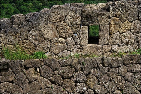 Gun Port. At several locations along the North walls of the castle, gun ports may be seen, where sentries could repel invaders. Photo copyright 2009 Michael Lynch.
Many visitors are surprised to learn that firearms were in existence in the 14th century.
Keywords: okinawa nakagusuku castle 