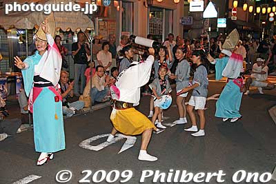 Niiza Kobushi-ren perform at Fureai Road which was the worst place to take pictures. They had a canopy (see left) and it obstructs the best view of the dancers. The crowd was sparse here.
Keywords: saitama kita-urawa awa odori dance matsuri festival dancers women 