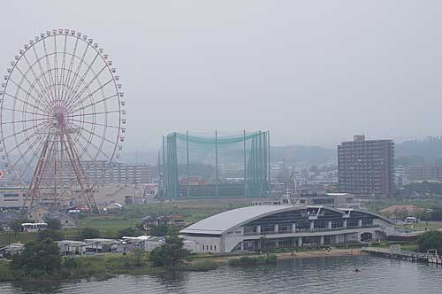 Katata is on the west end of Biwako Ohashi Bridge, opposite of Moriyama where the hotel was. The ferris wheel was part of an amusement park which closed over 10 years ago. It has been rusting and abandoned since.

