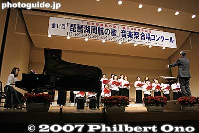 Each choir has to sing two songs: One is Biwako Shuko no Uta, and the second one could be any song. Each choir must sing both songs within 8 min.
Keywords: shiga takashima imazu-cho choir song contest competition biwako shuko no uta choircontest