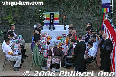 Priests chant in front of an altar.
Keywords: shiga hikone toro nagashi floating lantern festival