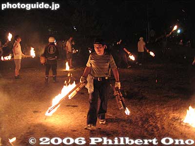 This man holds multiple torches.
Keywords: japan shiga hino-cho fire festival hifuri matsuri