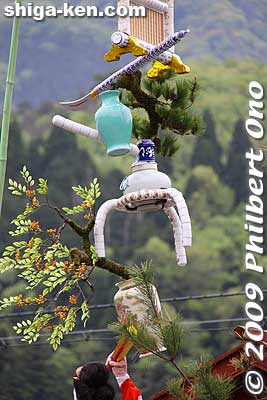 They are connected by only a slither of whatever they are connected with, yet the whole thing doesn't fall. 
Keywords: shiga nagahama yogo chawan matsuri float festival 