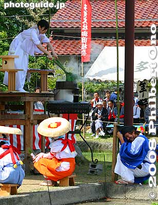 On the lower right, the guy in blue tries to shield himself from the spray of boiling water. The crowd laughed.
Keywords: shiga taga-cho taga taisha shrine shinto festival matsuri rice seedlings paddy paddies planting
