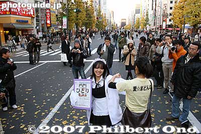 They sing on the street to advertise something, usually a night club where they appear.
Keywords: tokyo chiyoda-ku ward akihabara electronics shops stores shopping train station woman women girls maid cosplayers