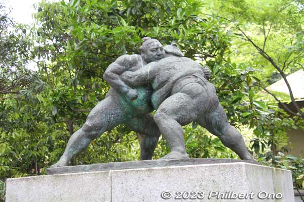 Statue of sumo wrestlers at the entrance of Yasukuni Shrine's sumo arena. The shrine has a large outdoor sumo arena with a capacity of  6,000. 
Keywords: tokyo Chiyoda-ku Yasukuni Shrine sumo japansculpture