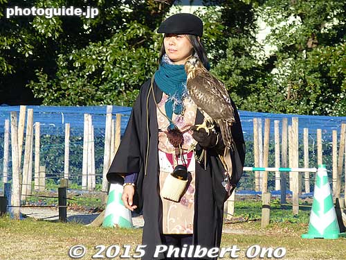 Notice that falconer wears a small pouch on his waist. It contains bird food. The bird is rewarded each time it does a trick. 
Keywords: tokyo chuo-ku hama-rikyu garden falconry birds