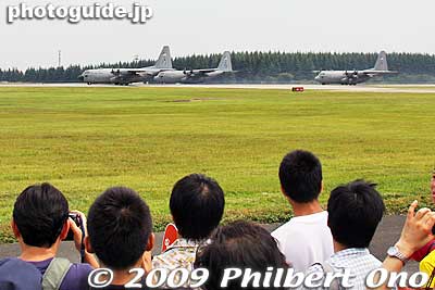 Three C-130 Hercules cargo planes start to take off one after another for an airborne demo.
Keywords: tokyo fussa yokota united states usa air base force military japanese-american japan america friendship festival airplanes jets aircraft 