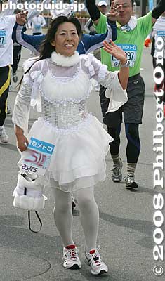Bridesmaid? Gosh, she's carrying a handbag.
Keywords: tokyo marathon runners race costume players cosplayers