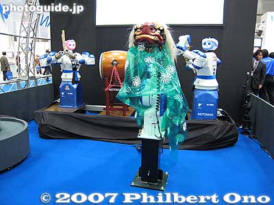 Lion dancing robot and robot taiko drummers in the background.
Keywords: tokyo robotics show fair trade humanoid robots