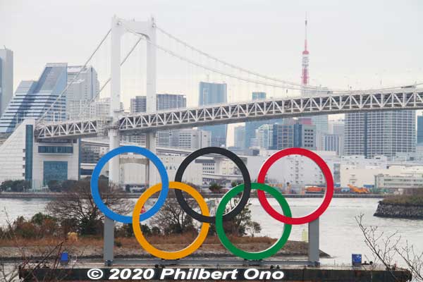 Olympic rings in Odaiba with Rainbow Bridge